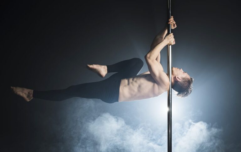 portrait-young-man-performing-pole-dance